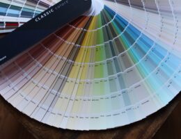 a fanned out stack of paint color samples